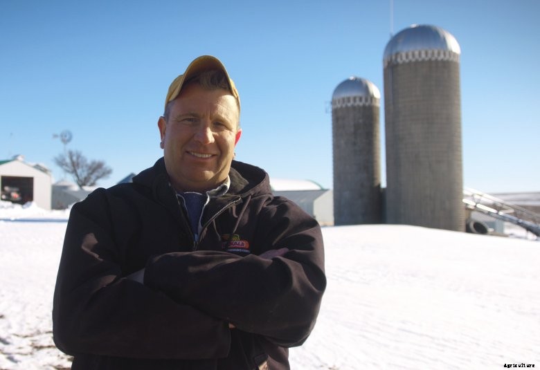 Iowa farmer Jerry Seuntijens stands on his farm on a snowy day